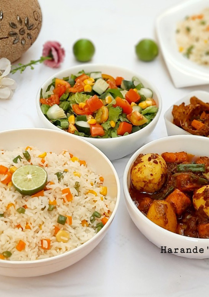 A picture of Lemon veg rice with potato carrot soup.