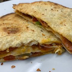 ‘Fridge raid “Mother Hubbard” style Tortilla stack #baking #fridgeforager A picture of ‘Fridge raid “Mother Hubbard” style Tortilla stack #baking #fridgeforager.