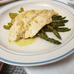 A picture of Apple cider fish with asparagus.