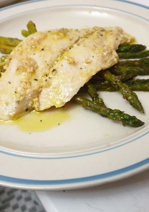 A picture of Apple cider fish with asparagus.