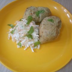A picture of Potatoes moi-moi and coleslow.