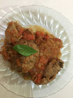 Una foto de Carne con jitomate y cebolla