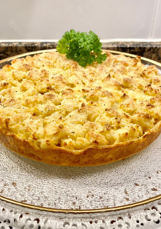 Una foto de Pastel salado de patata, butifarra y mozzarella