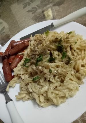 A picture of Basic cheesy pasta with English sausages.