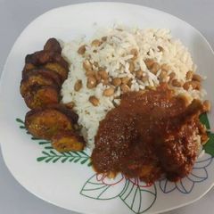 A picture of Rice and beans with fried plantain.