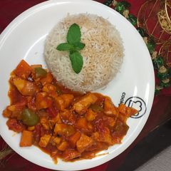 A picture of Chicken manchurian with brown rice.