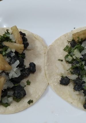 Una foto de Tacos de pastor negro