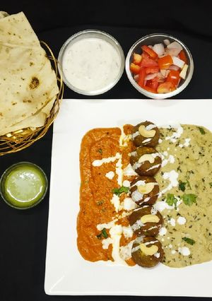 A picture of Gobhi mint kofta with shahi malai and makhani gravy.