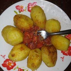 A picture of Deep fried potatoes with tomato concasse.