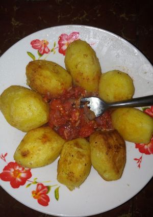 A picture of Deep fried potatoes with tomato concasse.