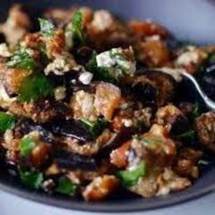 A picture of Grilled eggplant salad with walnuts.