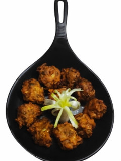 A picture of Spring onion & cauliflower fritters.