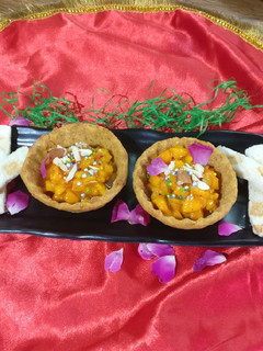A picture of Baked mango cups full with mango salsa.it is an innovative dish.