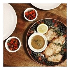 A picture of Pork loin steaks with mustard and butter sauce.