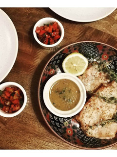 A picture of Pork loin steaks with mustard and butter sauce.