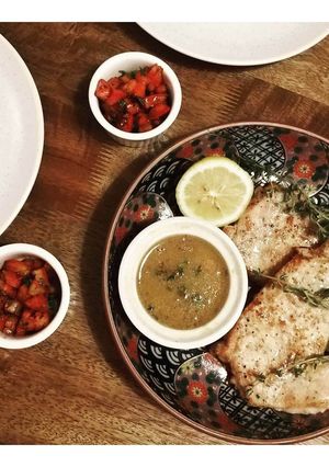 A picture of Pork loin steaks with mustard and butter sauce.