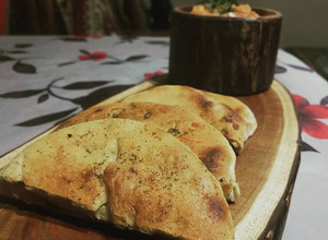 A picture of Baked Amritsari Kulcha With Matar Ki Chaat.