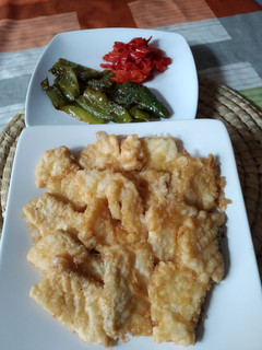 Una foto de Bacalao con pimientos
