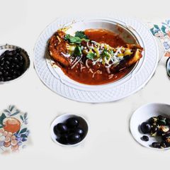A picture of Mexican Enchilada With black bean, cheese, black olives and etc. Stuffing.