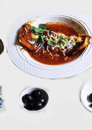 A picture of Mexican Enchilada With black bean, cheese, black olives and etc. Stuffing.
