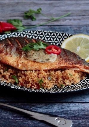 A picture of Spiced cous cous with seared seabass.
