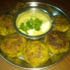 A picture of Green spinach patties with Broccoli almond soup.