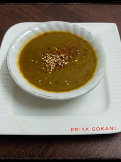 A picture of Palak, Tomato, Sweet Corn and Carrot Soup.
