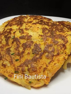 Una foto de Rosti de patata zanahoria y cebolla