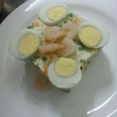 A picture of Russian salad with shrimps.
