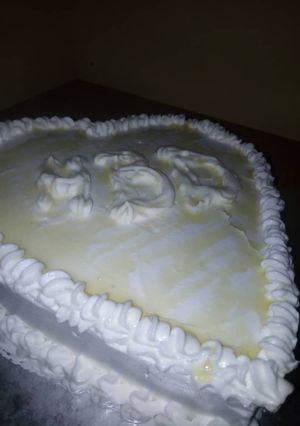 A picture of Vanilla Cake iced with whipped cream.