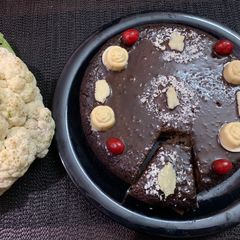 A picture of Cauliflower chocolate cake with chocolate leaves.