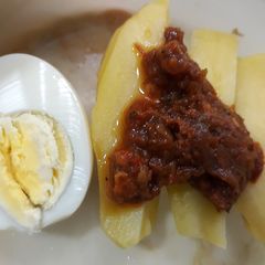 A picture of Irish potato with boiled egg.