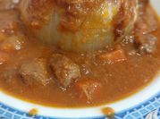 Una foto de cebollas rellenas de carne