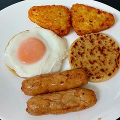 A picture of Simple Sausage,Potato patties, poached Egg & Hashbrowns.