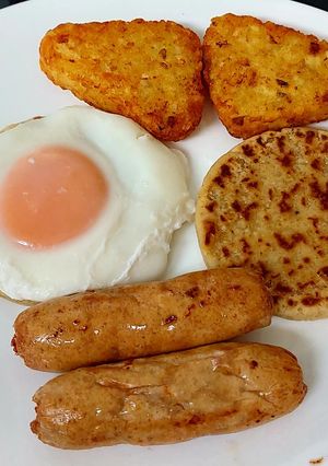 A picture of Simple Sausage,Potato patties, poached Egg & Hashbrowns.