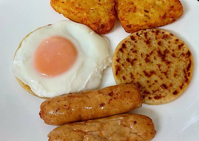 Simple Sausage,Potato patties, poached Egg & Hashbrowns