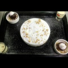 A picture of Yellow pearl cheese cake with kesar milk shots.