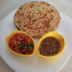 A picture of بیسن کی روٹی ساتھ چٹنیاں.
