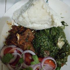Ugali with# beef challege#fryand kales A picture of Ugali with# beef challege#fryand kales.