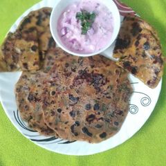 Methi Aloo Paratha and Beetroot Raita A picture of Methi Aloo Paratha and Beetroot Raita.