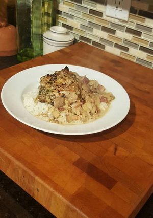 A picture of Roast Chicken Thighs in a Sautéed Mushroom Parmasan Garlic Cream.