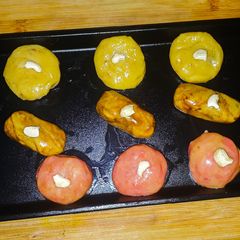A picture of Peda - kesar,coffee and rose milk essence.