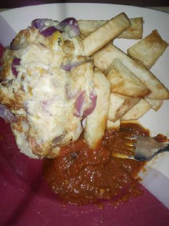 A picture of Fried yam with fried yam and sauce.
