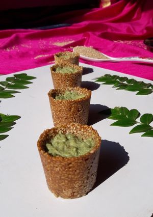 A picture of Til pot with curry leaves rabri.
