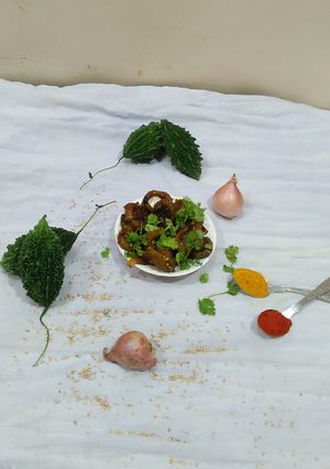 A picture of Onion and bitter gourd karela sabji.
