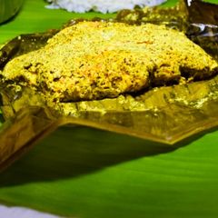 A picture of Prawn cocked in banana leaf.(chingri macher paturi).