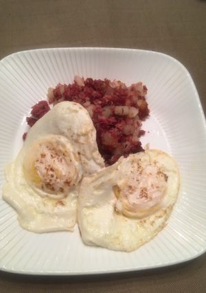 A picture of Corned Beef Hash with Eggs Over Easy.