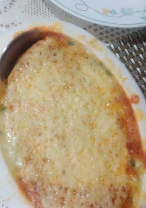 A picture of Green and pink sauce backed pasta.