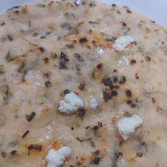 A picture of Rice flour roti with green garlic.