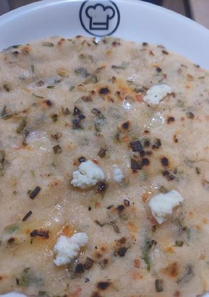 A picture of Rice flour roti with green garlic.